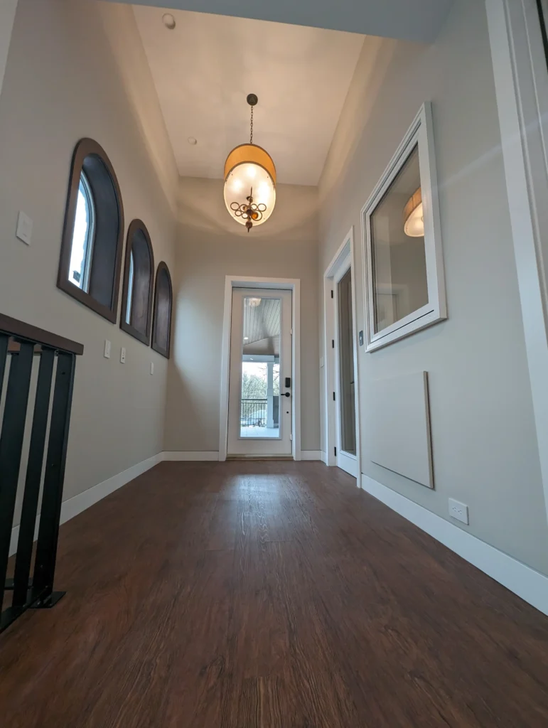 arched windows at elevator landing on second floor